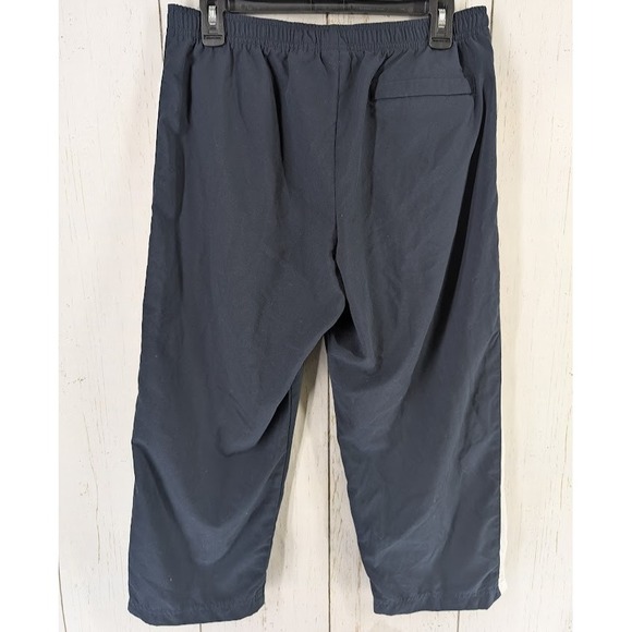 Under Armour Size Medium Dark Blue White Stripe Active Windbreaker Crop Pants - Picture 7 of 7